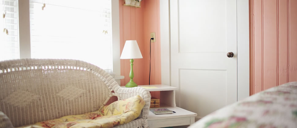 Spring Garden room located on the first floor with a wide shot of the room focusing on a lime green lamp