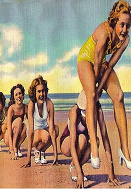 1950s style vintage postcard with girls in bathing suites and sandals playing on beach