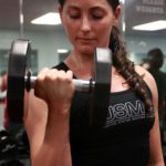 woman lifting dumbell